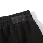 AMIRI Zoltar Tapered Logo-Print Cotton-Jersey Sweatpants